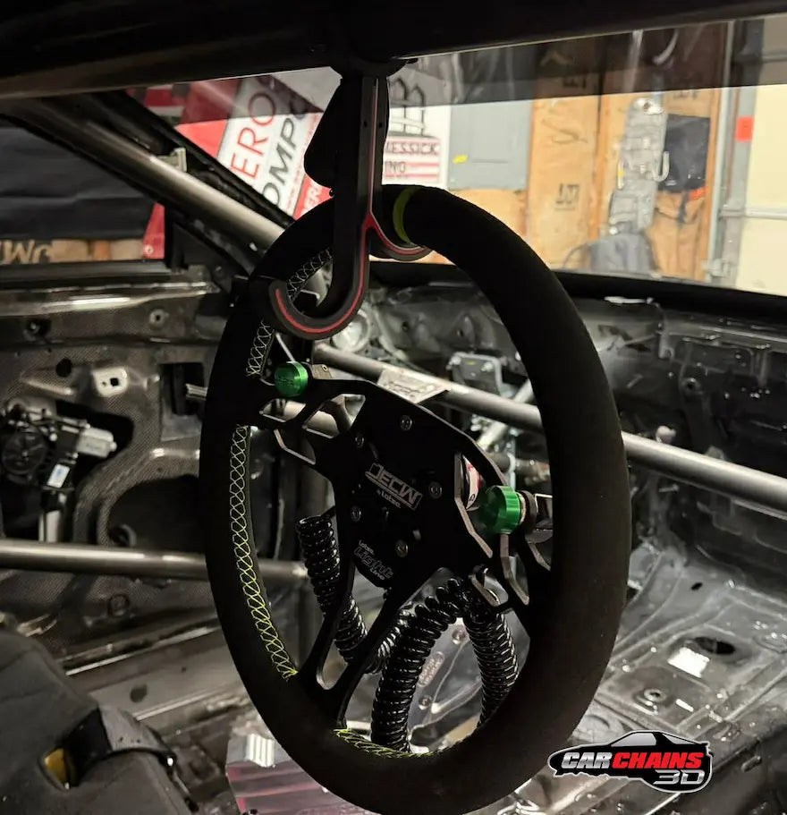 Quick release steering wheel mounted on Car Chains 3D dual hook roll cage holder inside stripped race car interior